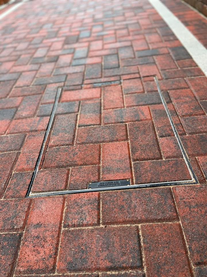 Red block paving ready for cleaning and repair