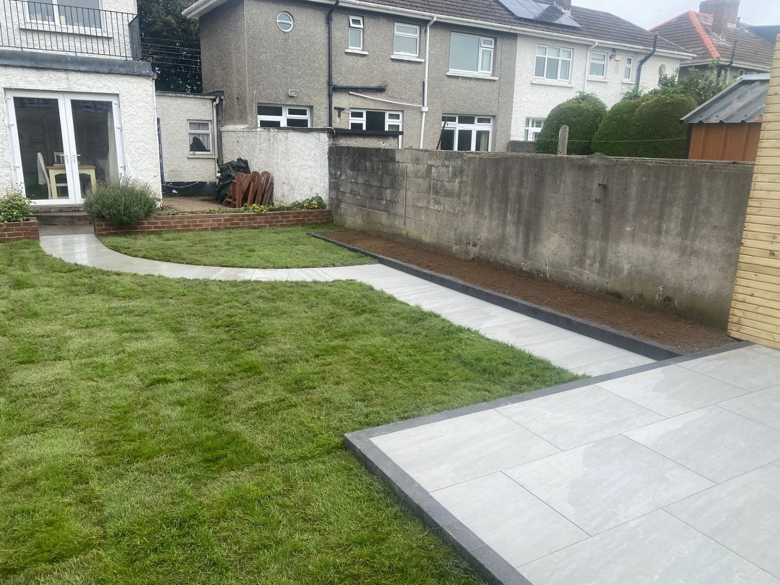 Landscaped garden with porcelain paving